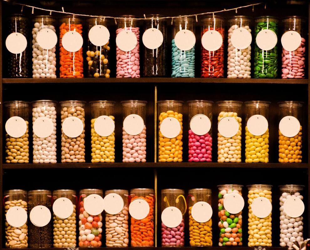 Jars of colorful candies on shelves